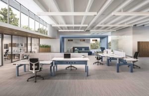 Modern office cubicle workstations with desks and partitions